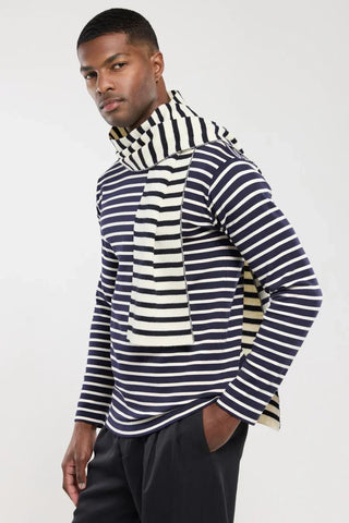 Man wearing a navy and white striped long-sleeve shirt with matching striped scarf, fashion apparel