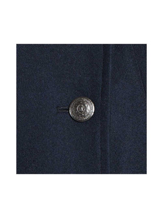 Close-up of navy wool coat with metallic anchor button detail for men