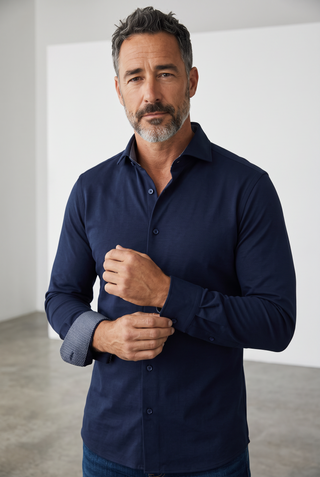 A man wearing a navy blue Emanuel Berg Byron long-sleeve shirt in 4Flex stretch fabric with a modern fit.