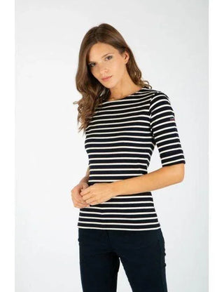 Woman wearing navy and white striped Breton shirt with three-quarter sleeves