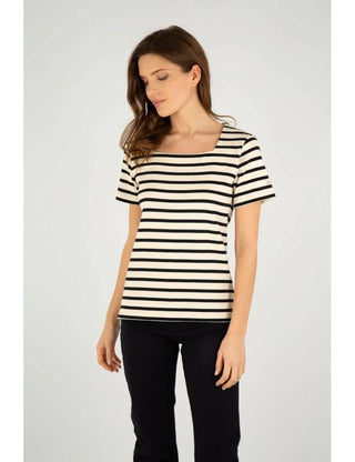 Woman wearing short-sleeve navy and white striped cotton marinière shirt and black pants