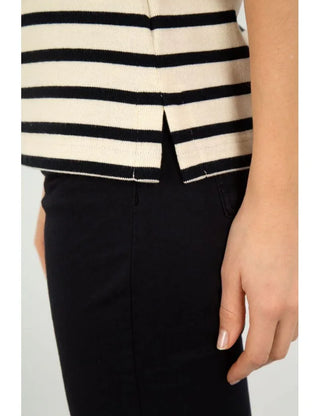 Close-up of a cream and navy striped cotton short-sleeve shirt with side slit detail