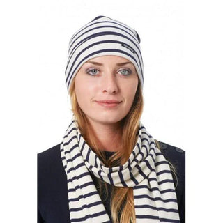 Woman wearing navy and white striped cotton scarf and matching beanie