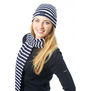 Woman wearing navy and white striped cotton beanie and matching scarf for winter fashion