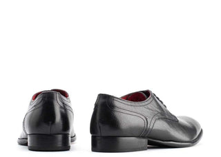 Men's black grain leather dress shoes with low heel, rear view, white background