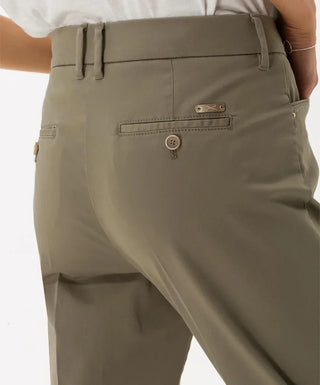 Close-up of back of khaki cotton satin capri pants with buttoned pockets