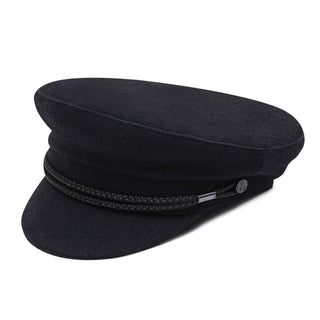 Black wool captain's hat with braided trim and anchor button detail on white background