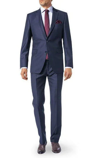 Man wearing navy wool suit with burgundy tie and pocket square, dress shoes