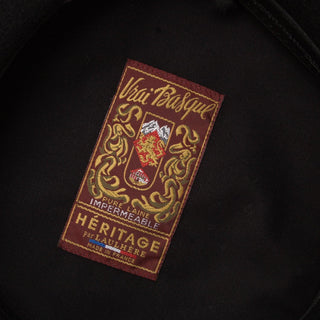 Heritage Vrai Basque beret interior label with embroidered crest on black fabric