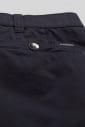 Close-up of dark cotton men's pants with front pocket and button detail
