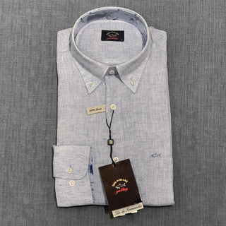 Folded light blue linen long sleeve shirt with button-down collar and logo tag
